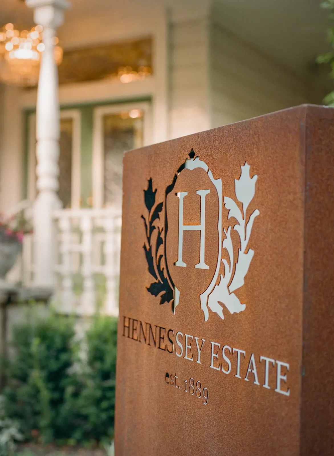 Hennessey Estate sign in front of the covered porch.